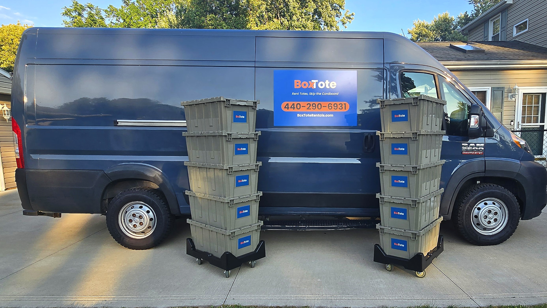 BoxTote delivery van with stacks of reusable plastic moving totes